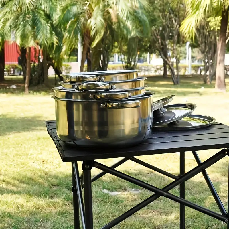 Conjunto de panelas de aço inoxidável de 4 peças com tampas e alças duplas, adequado para uso na cozinha.